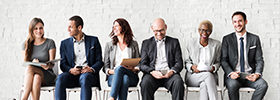 Office workers sitting on a bench