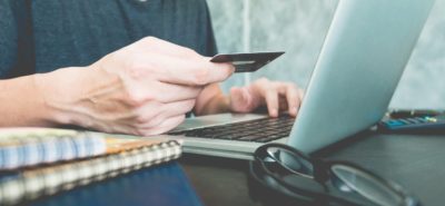 woman paying online in a laptop